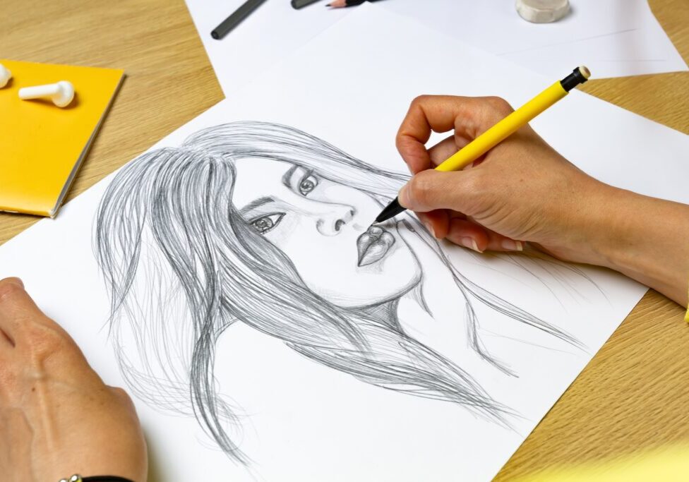 The,Artist,Draws,A,Pencil,Portrait,Of,A,Young,Beautiful